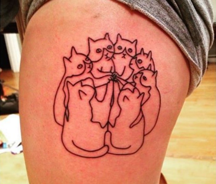 Gatos compinchados tatuaje
